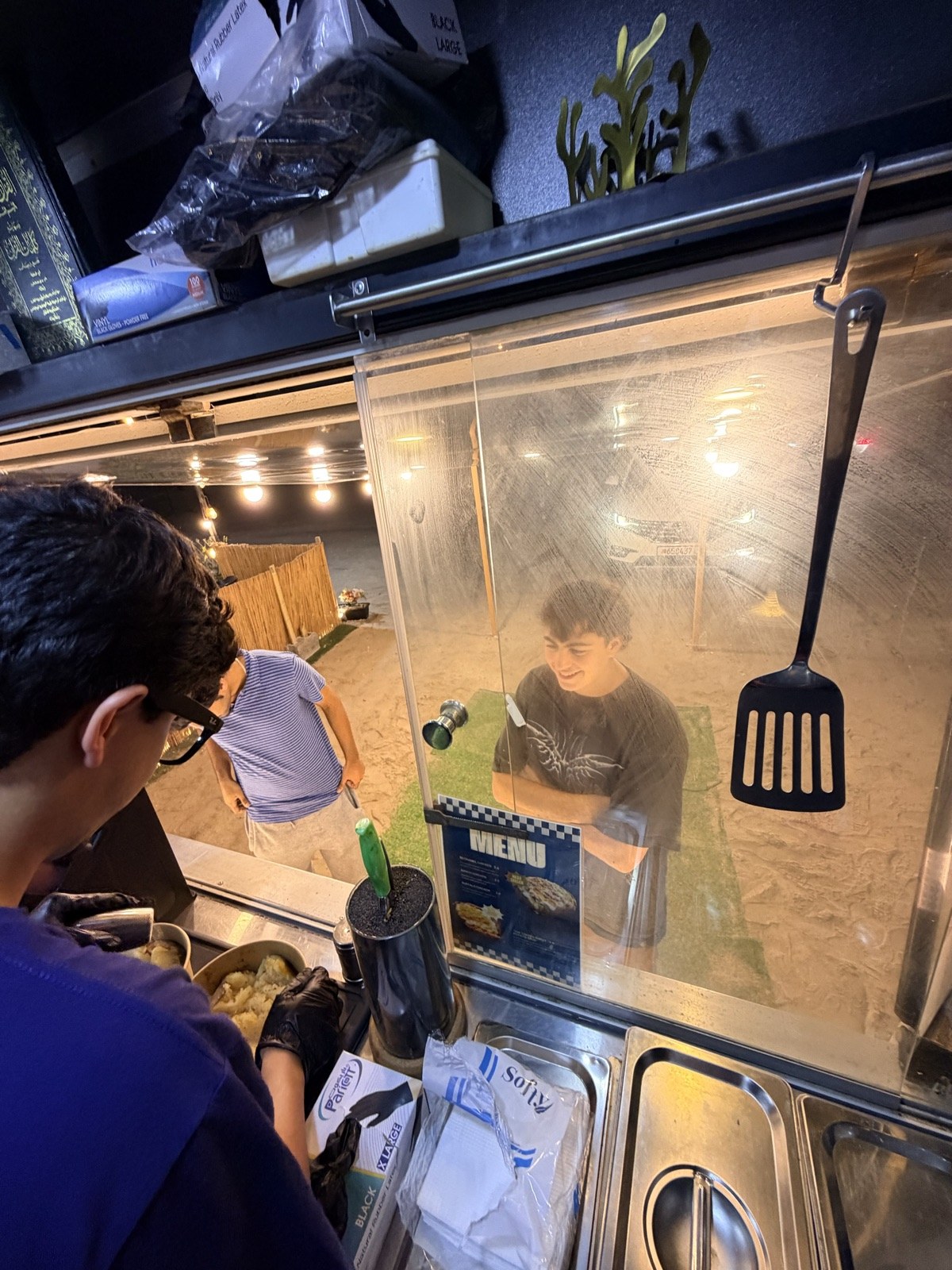 A busy night of orders at the Spudlicious window
